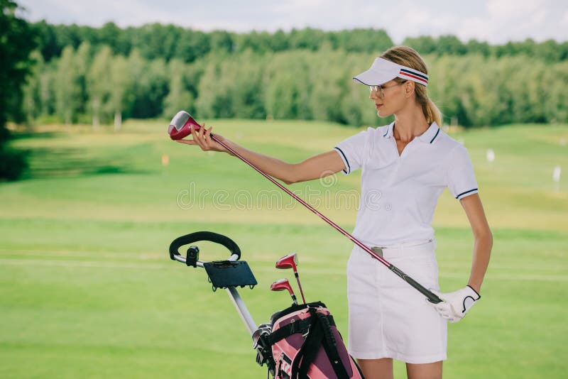 Portrait of Female Golf Player in Cap with Golf Gear Stock Image