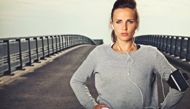 Serious female jogger outdoors looking confident. Determined jogger stock images, royalty-free photos and pictures