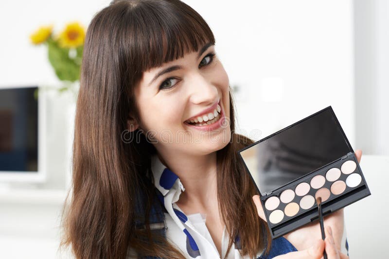 Female Vlogger Presenting Make Up Tutorial Video royalty free stock photos