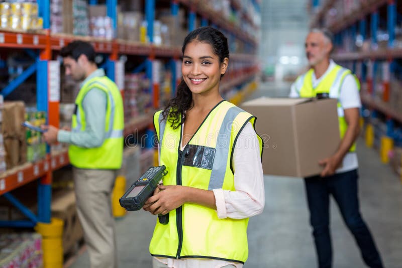 Portrait of Female Warehouse Worker Standing with Barcode Scanner Stock