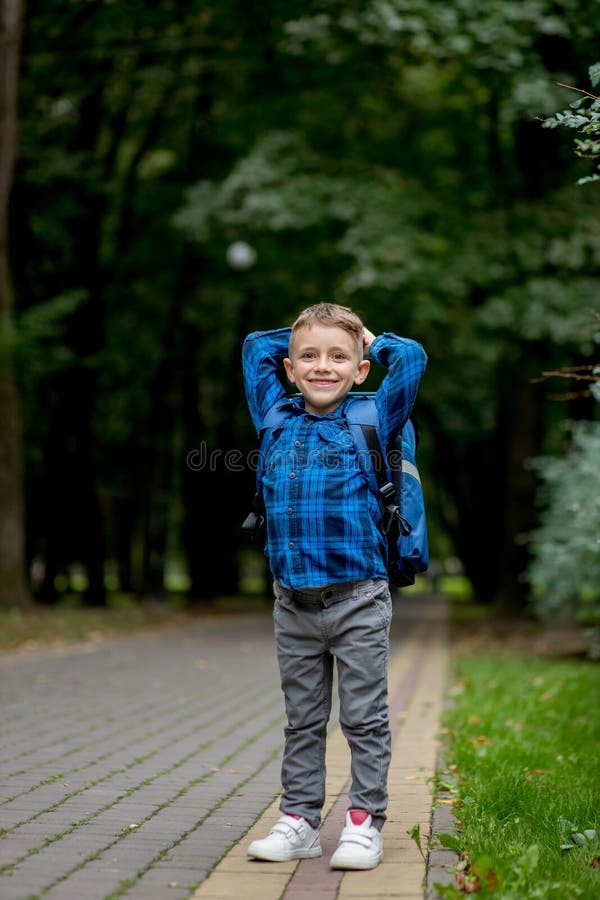 Portrait of a First Grader with a Backpack. the Boy Goes To School