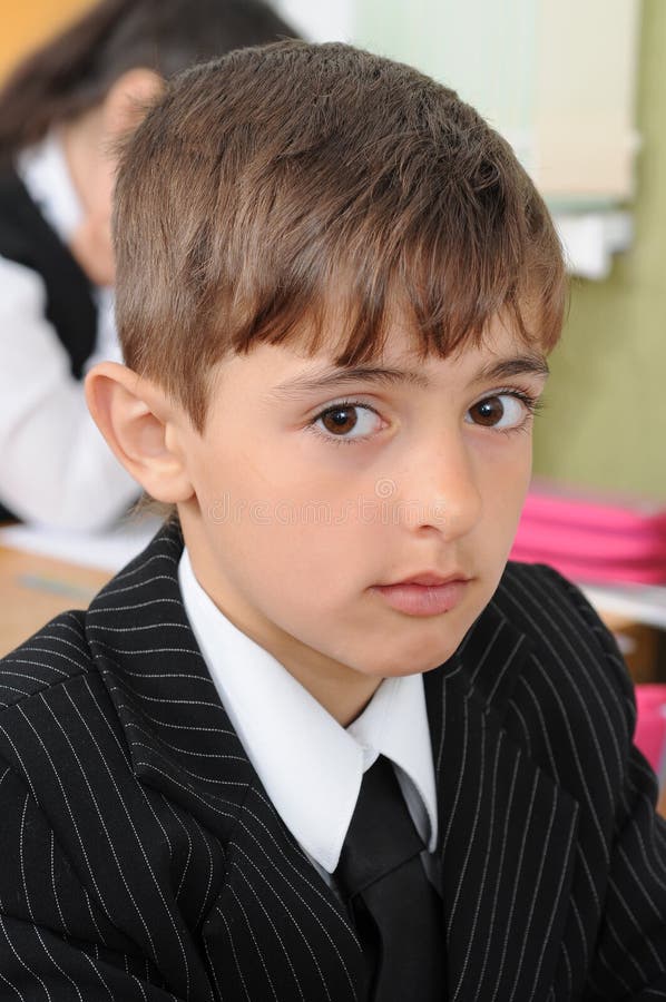 Portrait of the first-grader at a lesson.