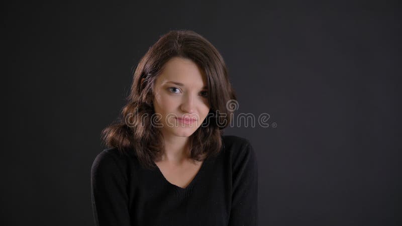 Portrait Of Fragile Young Brunette Woman Watching Shyly Into Camera On ...