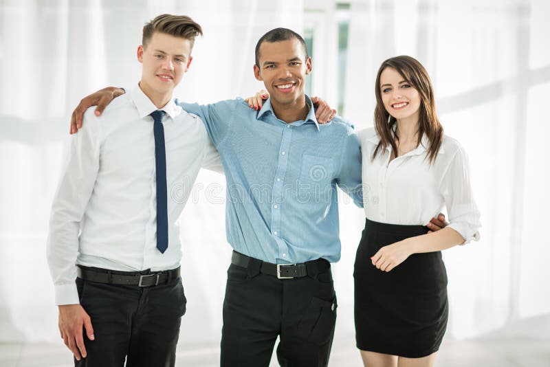 Portrait of friendly business team in the background of the office royalty free stock photography Portrait of friendly business team in the background of the office royalty free stock photography