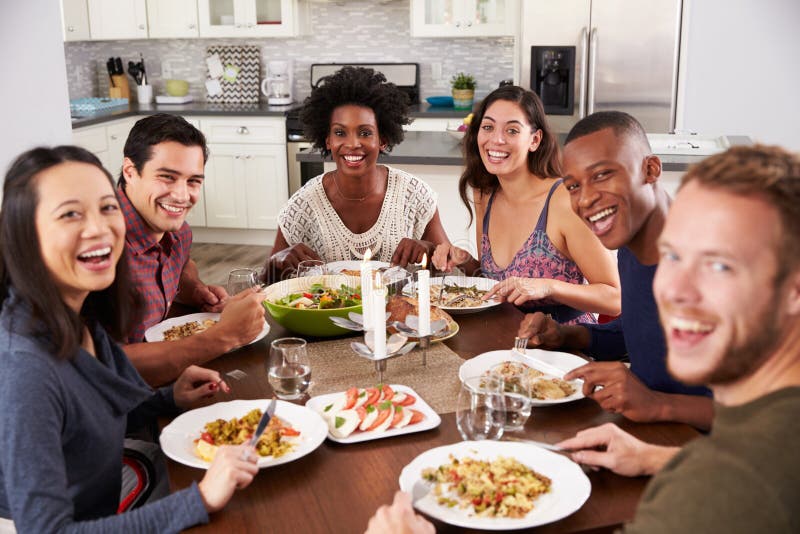 Portrait Of Friends Enjoying Dinner Party At Home Stock Image - Image