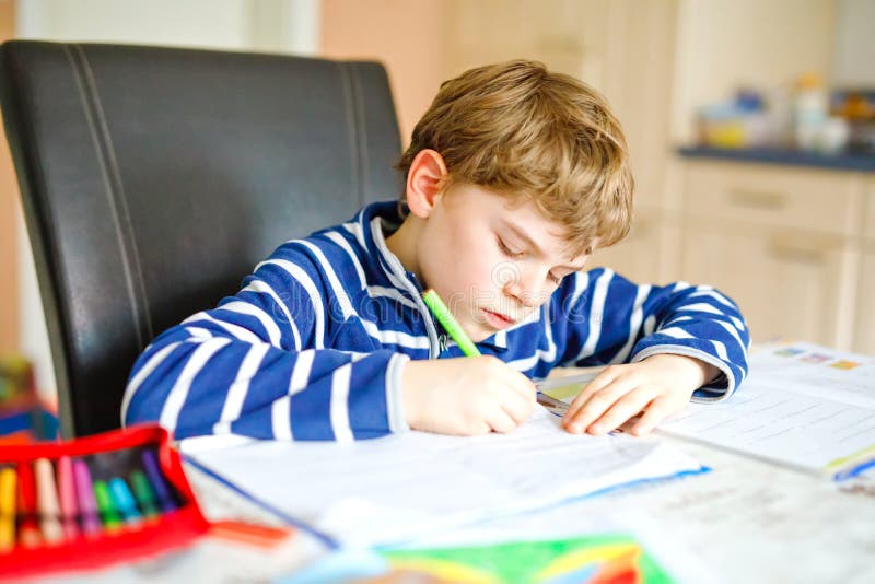 little boy crying doing homework