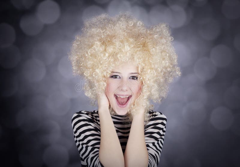 Portrait of funny girl in blonde wig