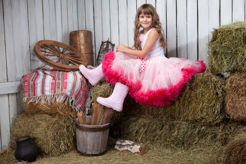 Portrait of funny girl near pail