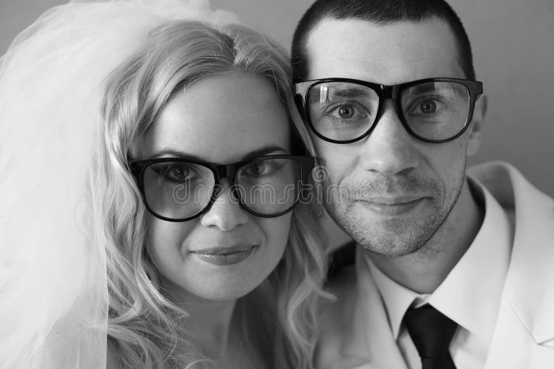 Portrait of funny handsome hipster family (bride and groom)