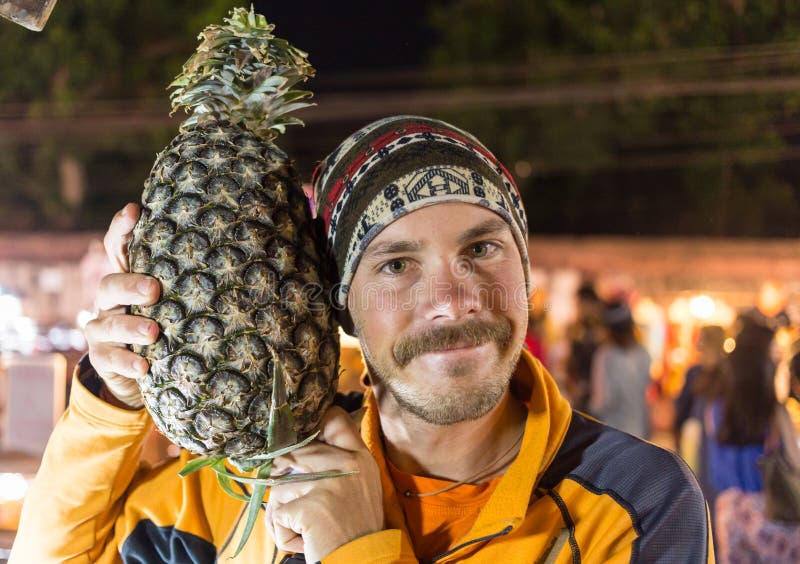 Portrait of funny man with great pineapple stock photography Portrait of funny man with great pineapple stock photography