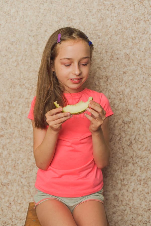Portrait Of Girl Biting Melon G