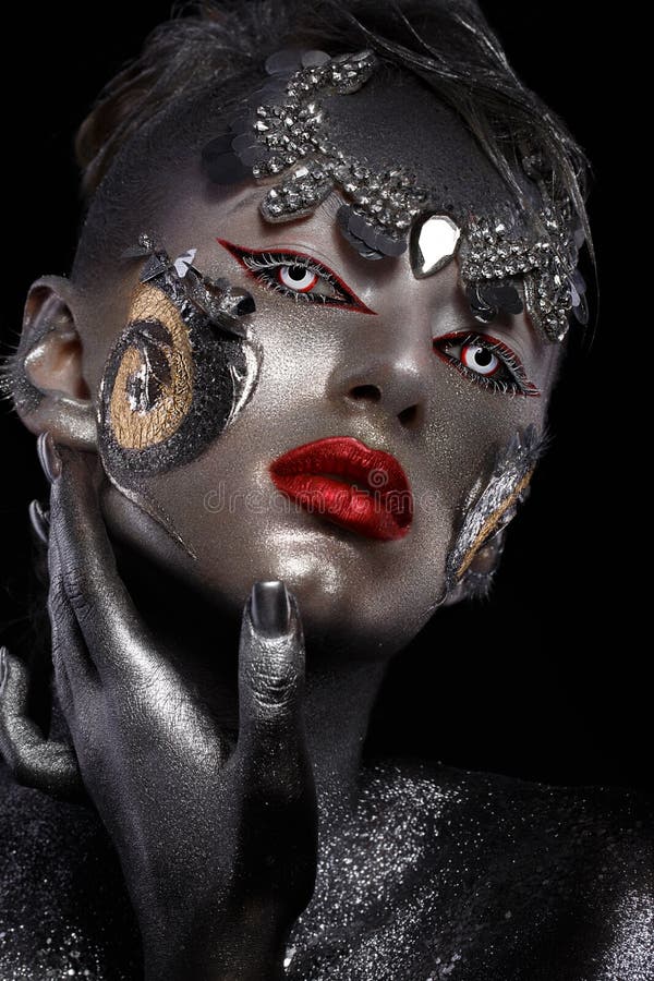 Portrait of a girl with creative art make-up. Unusual image.