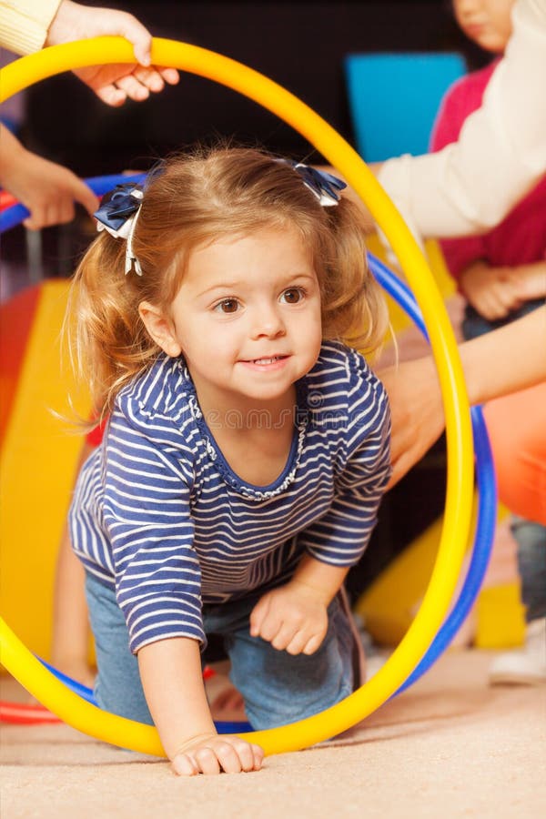 Portrait of a girl go though hoop in active game stock photos Portrait of a girl go though hoop in active game stock photos