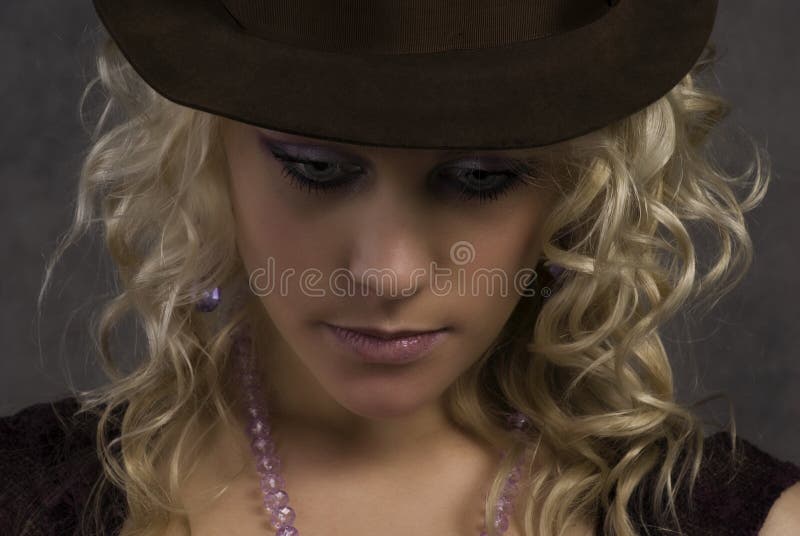 Portrait of the girl in a hat stock images