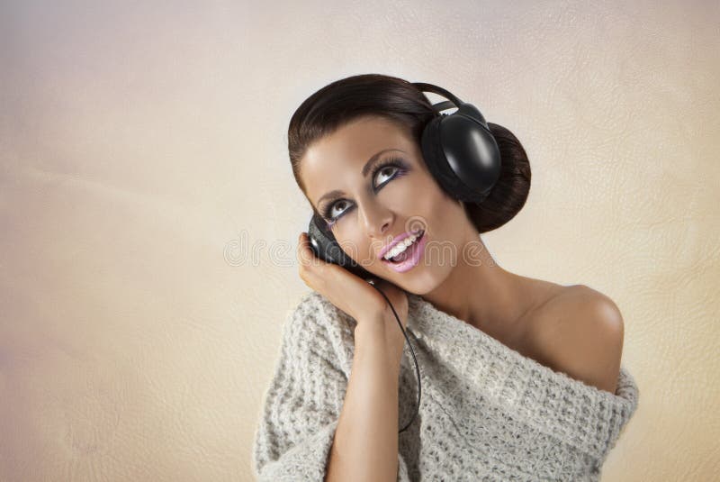 portrait of a girl in headphones listening music