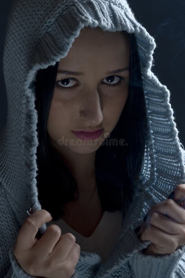 Portrait of girl in hood in dark royalty free stock photo