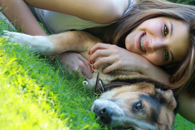 Portrait of girl hugged to her dog