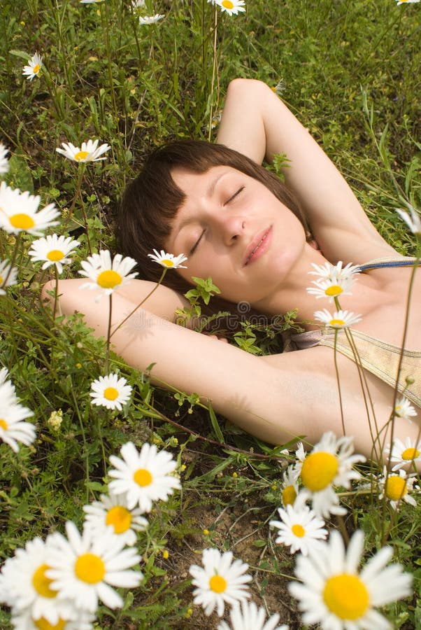 The portrait of girl in the middle of flower