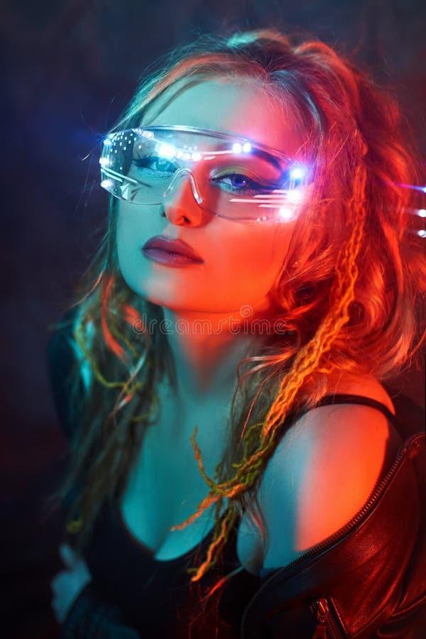 Premium Photo  Cyberpunk woman futuristic portrait urban fashion  mysterious girl in face bandana buff mask black leather jacket in red  purple neon light color steam white led glow at dark night