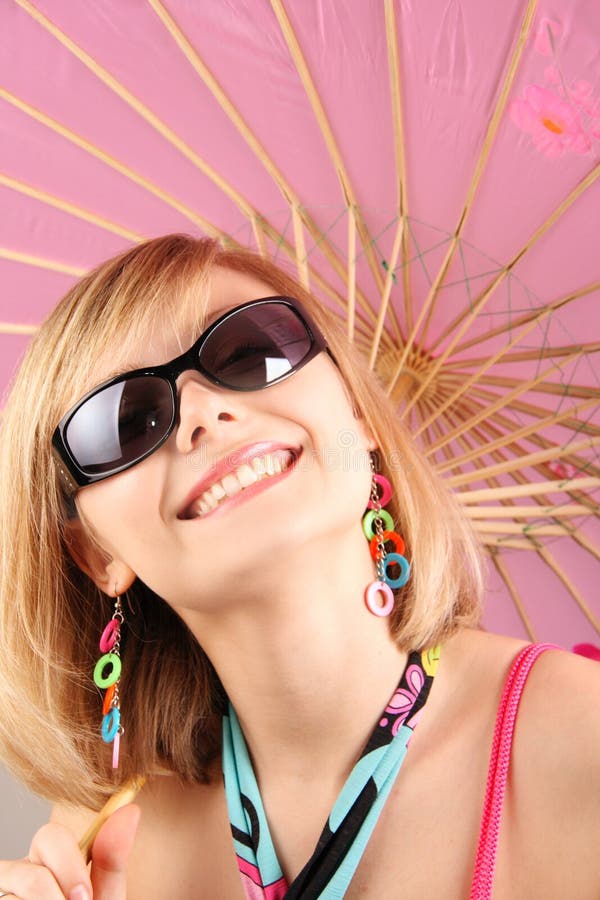 Portrait of girl with pink umbrella