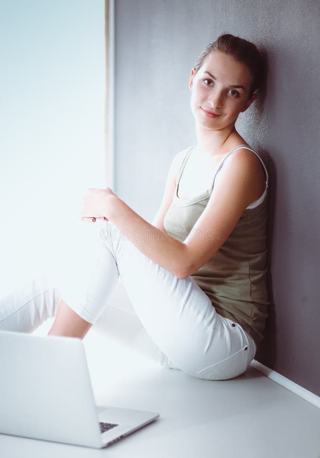 Portrait of a Girl Sitting on Floor and Using Laptop Stock Image ...