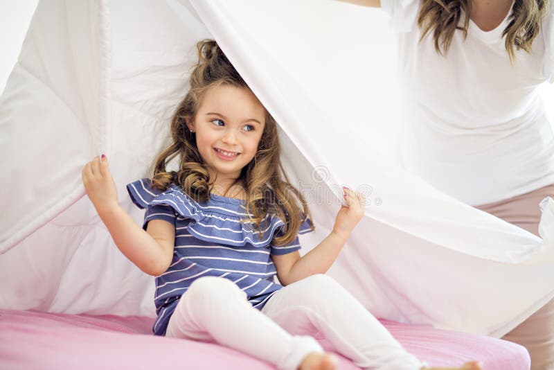 Portrait Of A Girl Under Covers By White Sheet Stock Photo Image Of