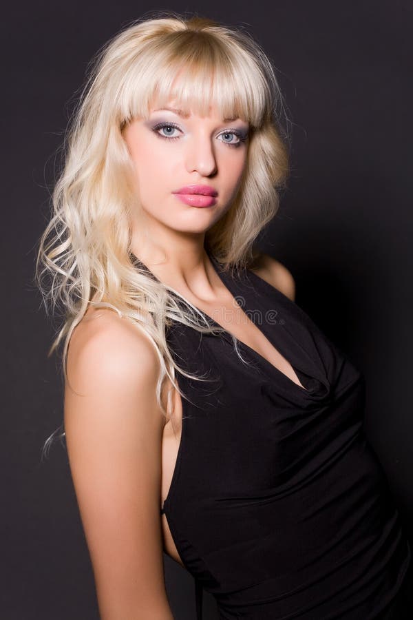 Portrait of glamour girl in black dress, studio shot