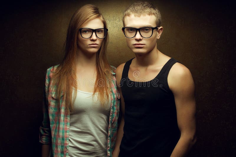 Portrait of gorgeous red-haired fashion twins in casual shirts