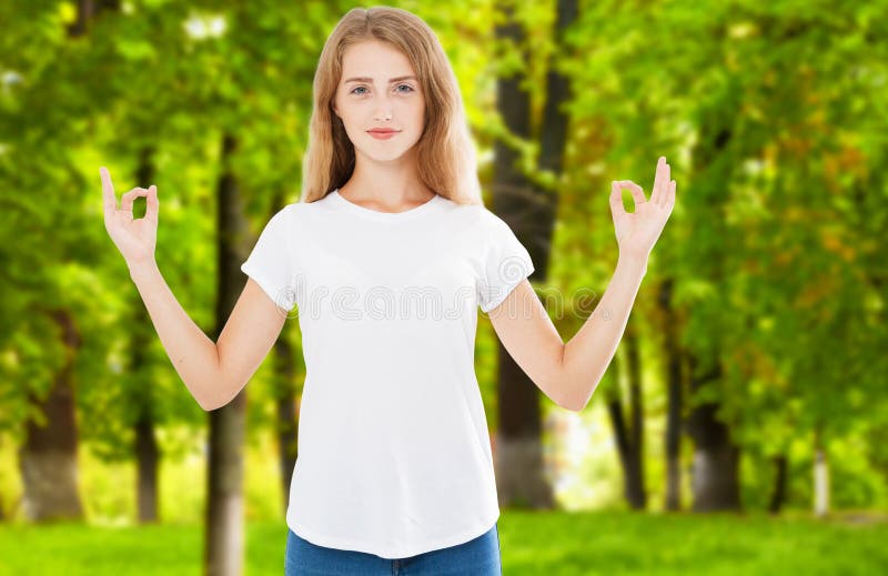 Portrait of gorgeous young woman keeping eyes open while meditating indoors, practicing piece of mind, keeping fingers in mudra royalty free stock photos Portrait of gorgeous young woman keeping eyes open while meditating indoors, practicing piece of mind, keeping fingers in mudra royalty free stock photos