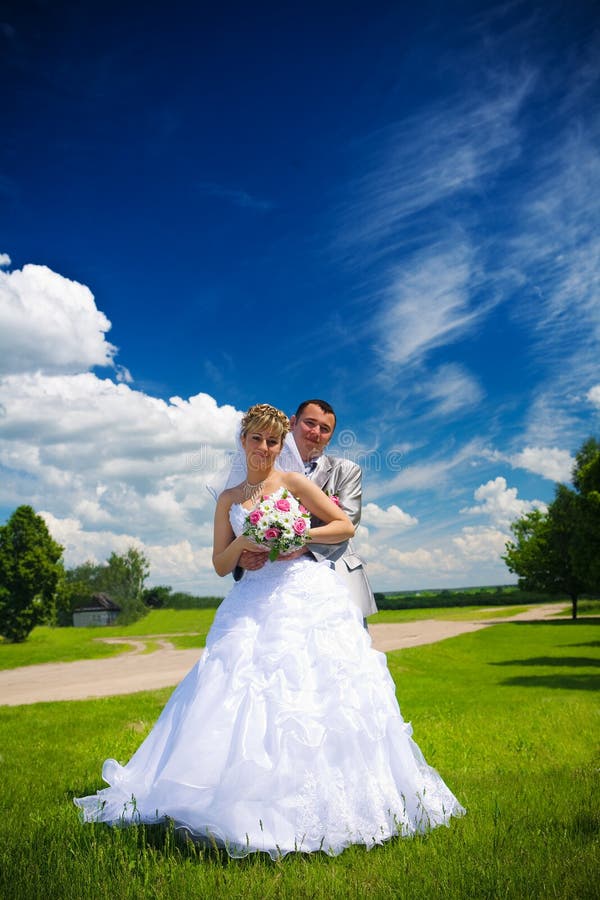 Portrait of the groom and the bride on the nature