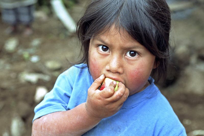 Portrait Guatemalan Indian girl eating an apple stock image Portrait Guatemalan Indian girl eating an apple stock image