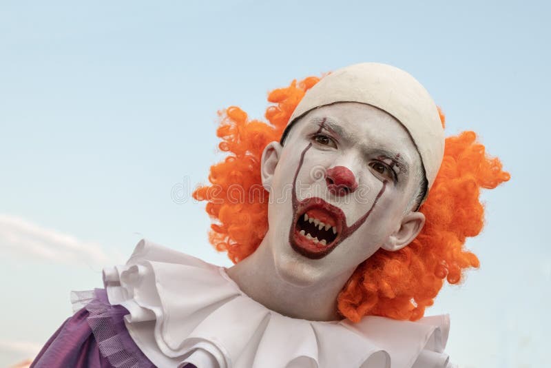 A Man Costumed as Pennywise Making Scary Face Reaction · Free Stock Photo