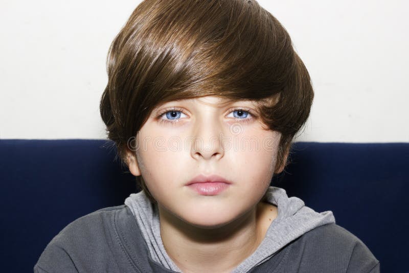 A portrait of a handsome blue eyes boy. Kid possing