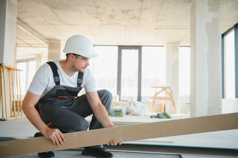 Portrait of handsome construction worker on building industry construction site stock images