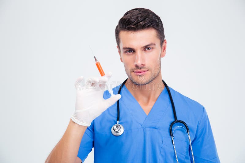 Portrait of a handsome male doctor holding syringe