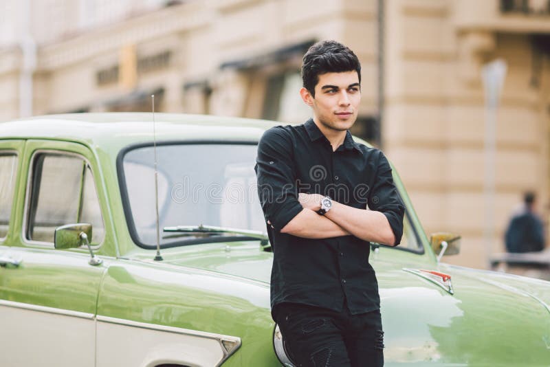 Casual Style Man Posing by Car in the Evening · Free Stock Photo
