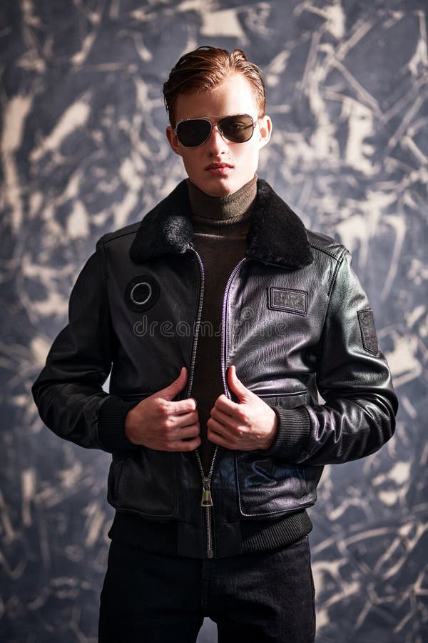 https://thumbs.dreamstime.com/b/portrait-handsome-man-black-leather-jacket-black-sunglasses-grunge-background-man-s-fashion-pilot-handsome-man-219708177.jpg