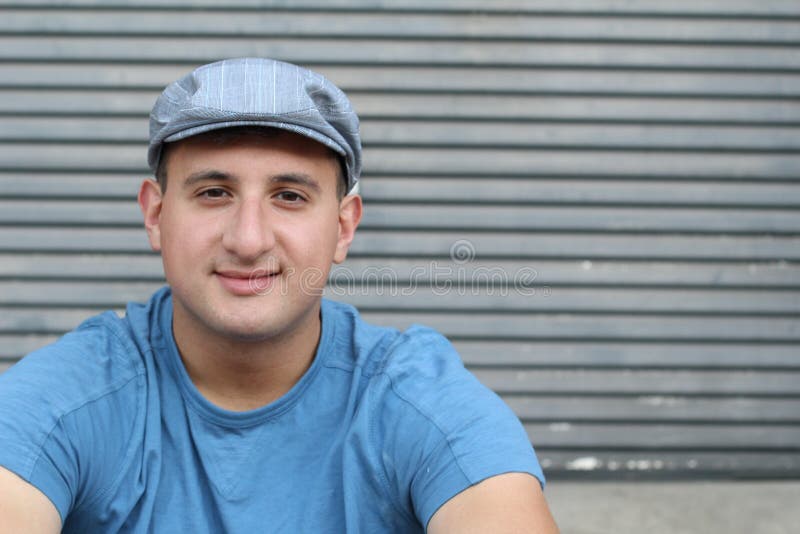 Portrait of handsome real looking man in hat sitting outdoors royalty free stock photos Portrait of handsome real looking man in hat sitting outdoors royalty free stock photos