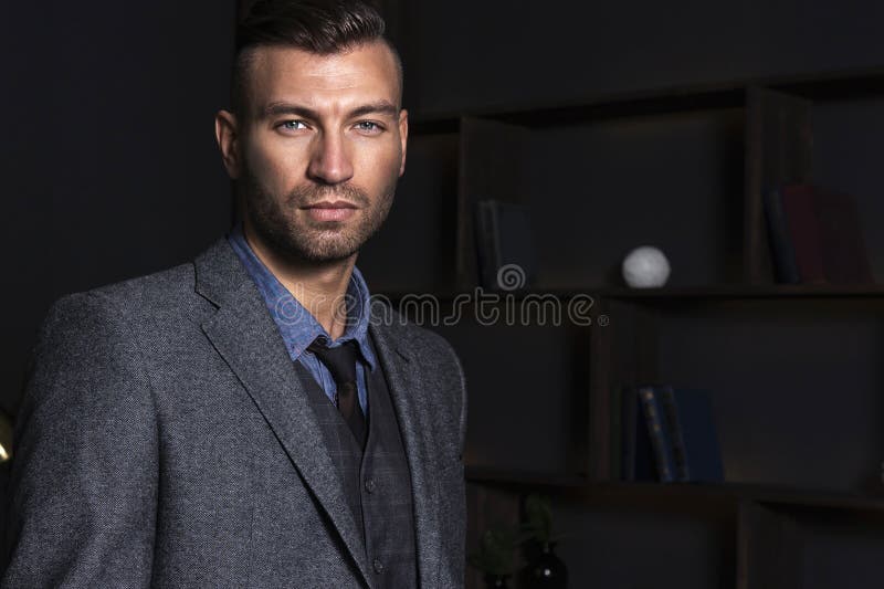 Portrait of a handsome stylish man in a suit. Business man with a confident look stock image Portrait of a handsome stylish man in a suit. Business man with a confident look stock image