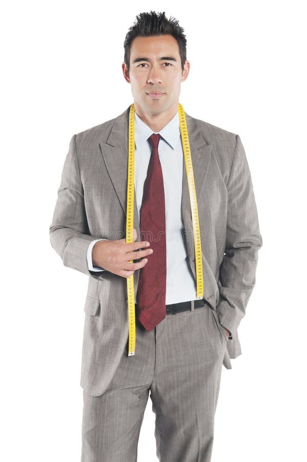 Portrait of handsome tailor standing over white background stock images