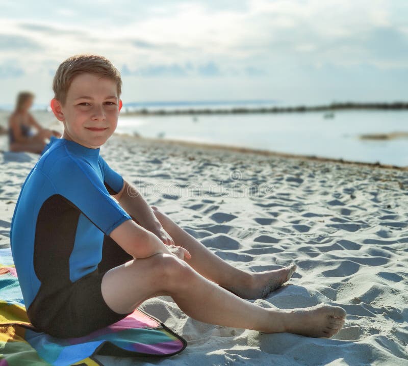 Handsome Teen Boy in Neoprene Swimsuit in Baltic Sea Stock Image