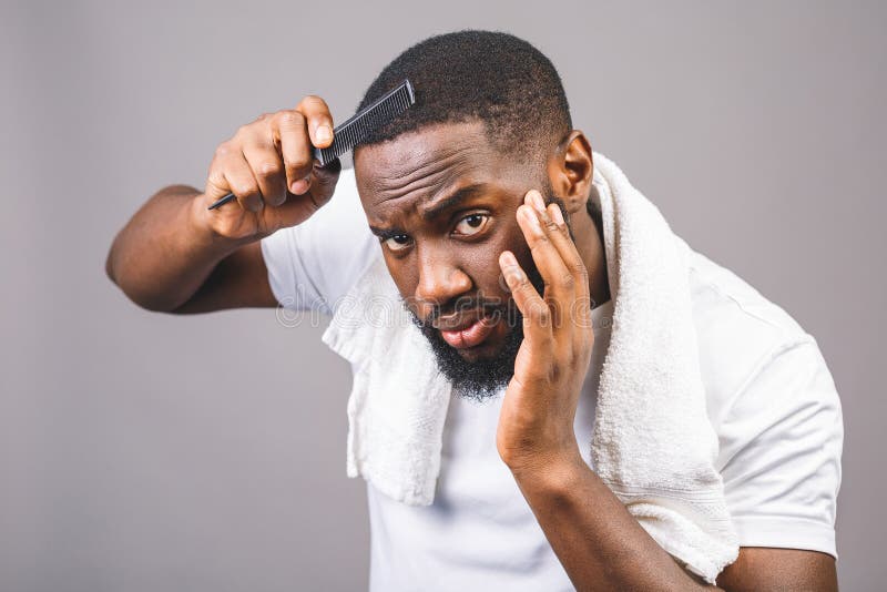 Portrait of Handsome Young African American Black Man Combing His Hair in Bathroom. Isolated Over Grey Background Stock Photo - Image of hairstyle, afro: 185903666 Portrait of Handsome Young African American Black Man Combing His Hair in Bathroom. Isolated Over Grey Background Stock Photo - Image of hairstyle, afro: 185903666