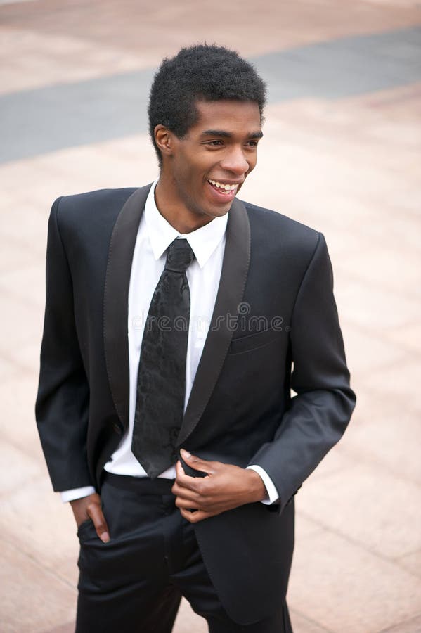 Portrait of a handsome young african american businessman smiling outside