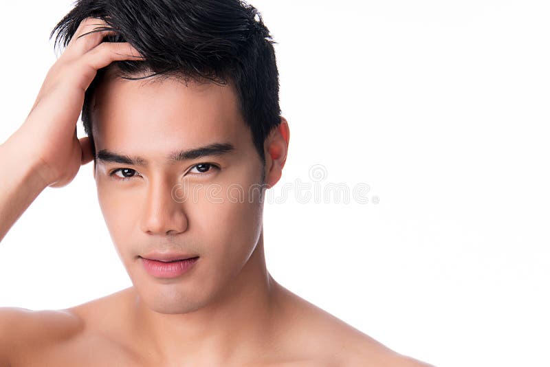 Portrait of Handsome young asian man on white background. Concept of men`s health and beauty, self-care, body and skin care