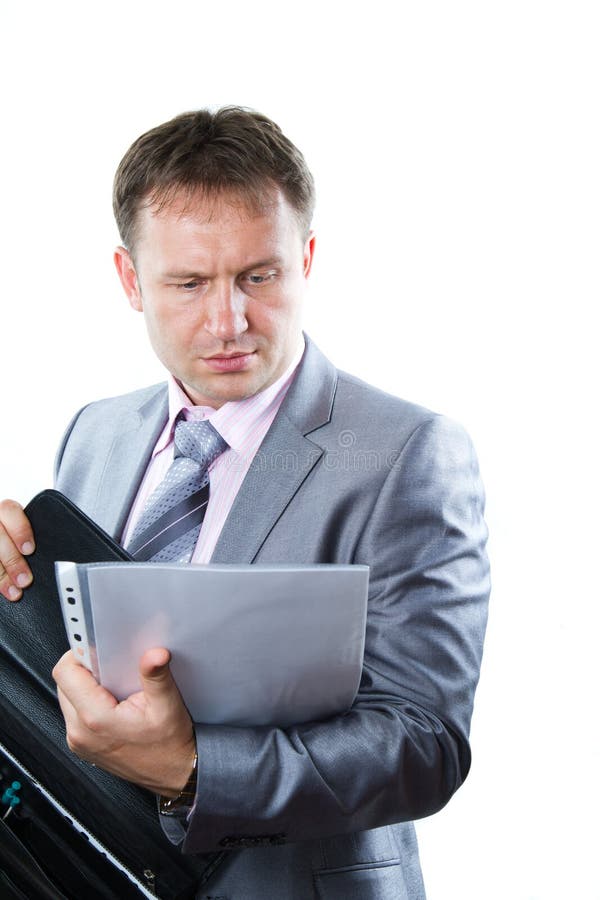 Portrait of a handsome young businessman in suit isolated