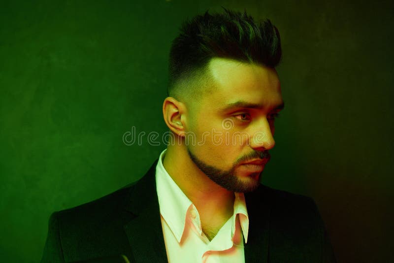Portrait of Handsome Young Man Against Studio Background. Stock Photo - Image of fashionable, confident: 182179920 Portrait of Handsome Young Man Against Studio Background. Stock Photo - Image of fashionable, confident: 182179920