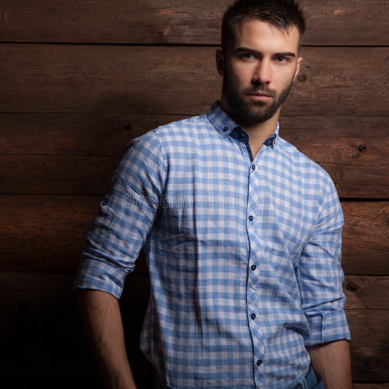 Portrait of handsome young man on wooden background. stock photography Portrait of handsome young man on wooden background. stock photography