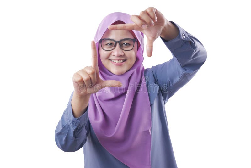 Muslim Woman Smiling at Camera While Framing Her Face With Hands