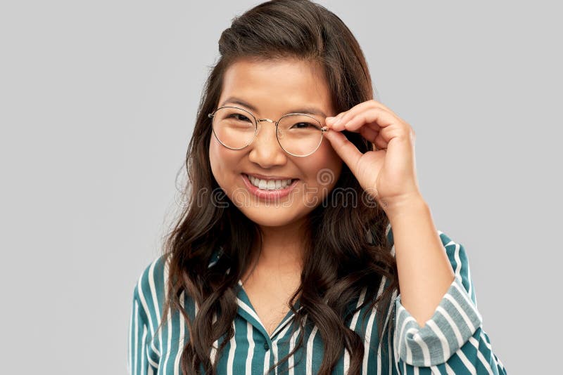 Portrait of happy asian woman in glasses