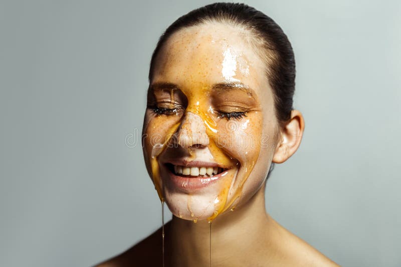 Portrait of happy beautiful young brunette woman with freckles and honey on face with closed eyes and toothy smile happiness face stock photos Portrait of happy beautiful young brunette woman with freckles and honey on face with closed eyes and toothy smile happiness face stock photos